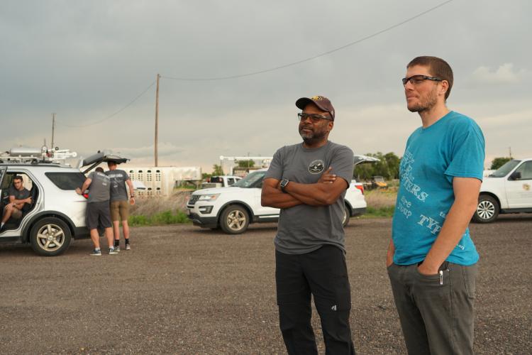 Brian Argrow talking with another team member 